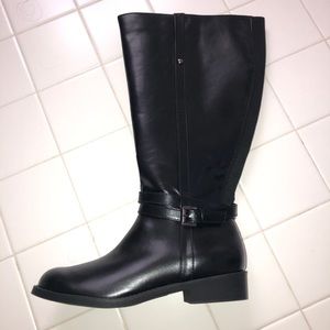 Woman’s size 8, wide calf. Never worn.